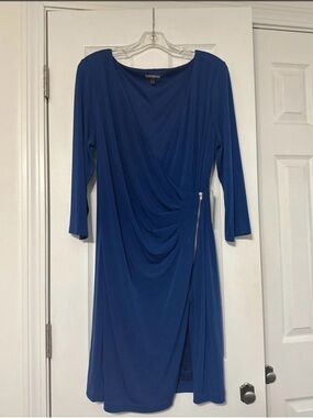 Express wrap dress featuring a side zipper and 3/4 sleeves. Vibrant blue. Size L
